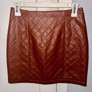 Brown faux leather quilted skirt.